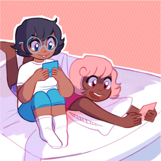 Jane and Roxy are playing video games on a bed.